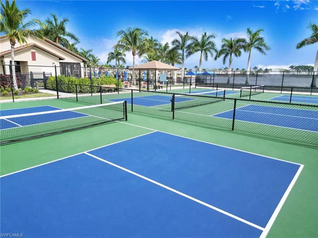 View of tennis court featuring a gazebo