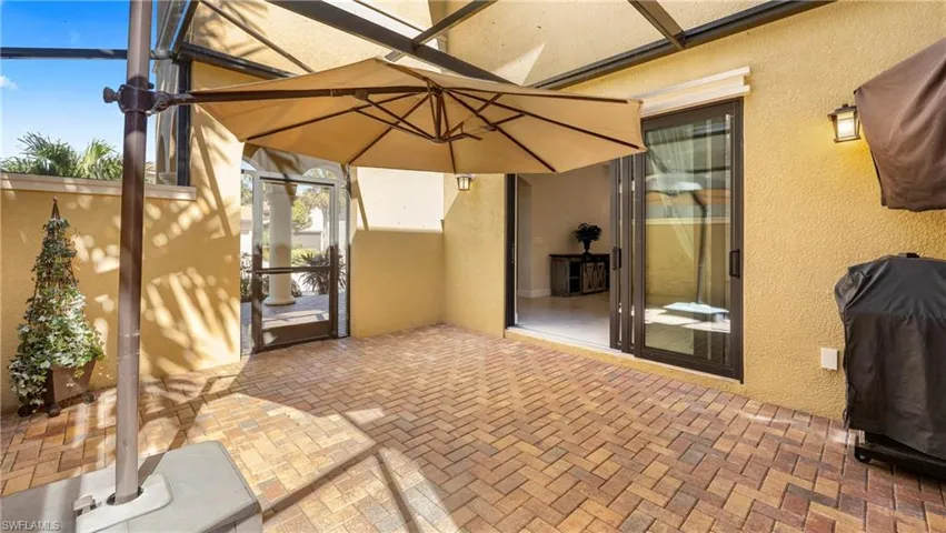 View of patio / terrace featuring a lanai and grilling area
