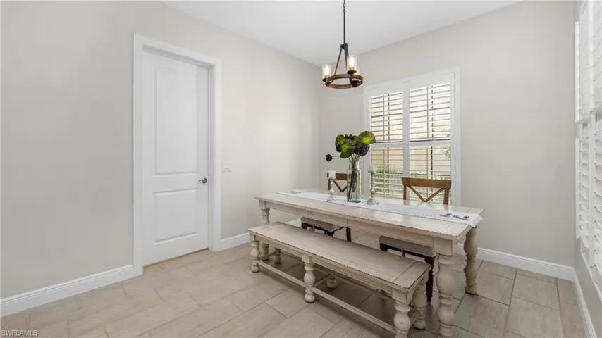 Dining room featuring suspended lighting and wood finish floors
