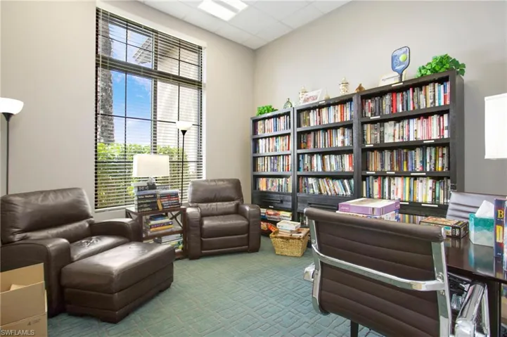 Sitting room featuring a paneled ceiling