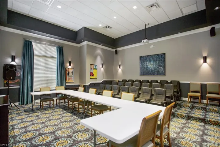 Dining area featuring a high drop ceiling and recessed lighting