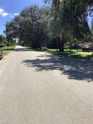 View of asphalt road to the west