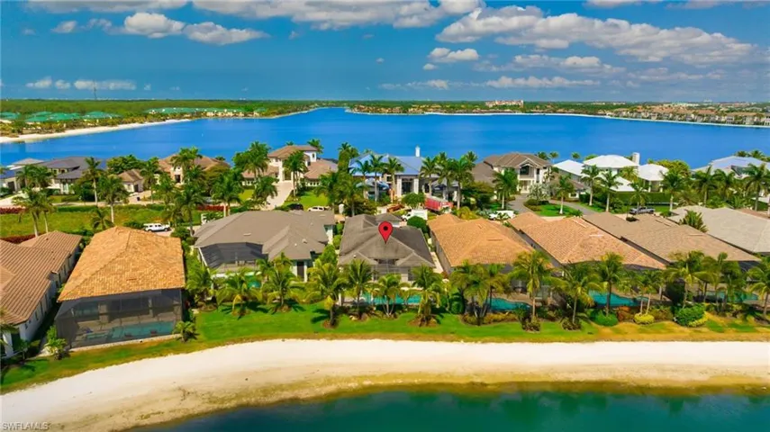Aerial view of residential area with unending shoreline