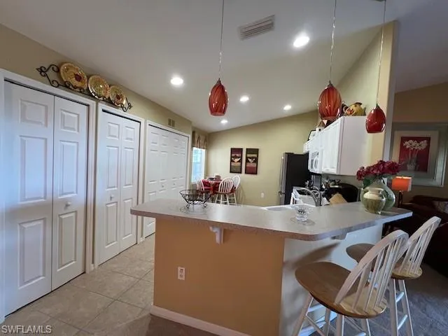 Eat-In Kitchen with a breakfast bar open to the Dining Rm