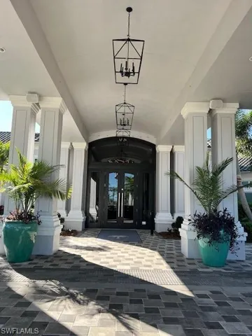 Property entrance featuring french doors