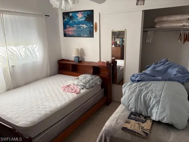 Bedroom with a closet and ceiling fan