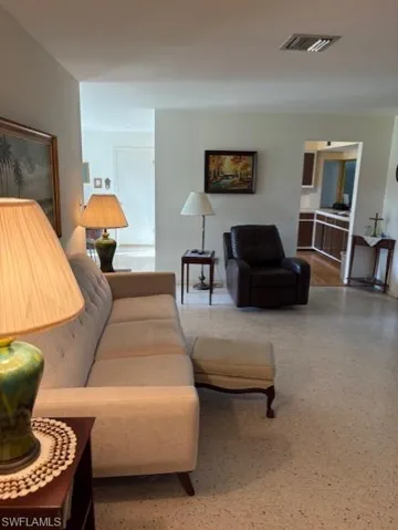 Living area featuring speckled floor