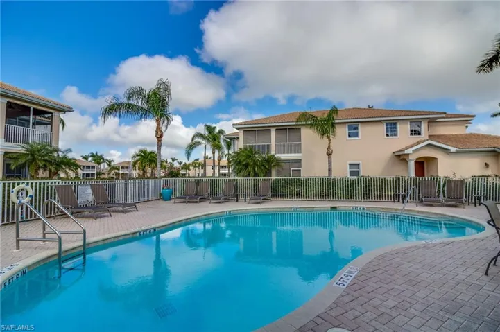 Community pool featuring a patio
