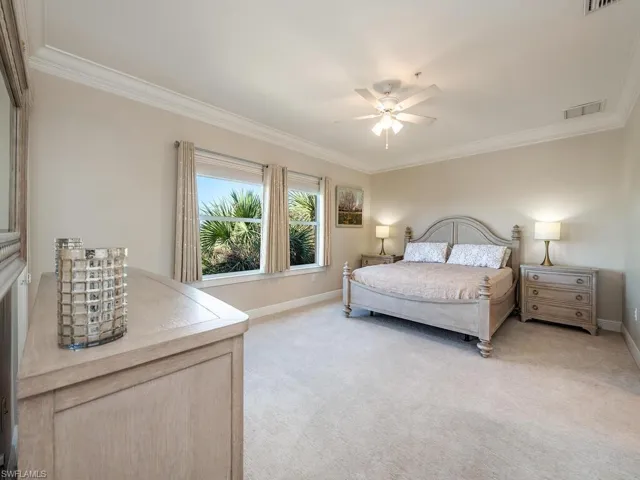 Spacious primary  bedroom with access to the lanai and beautiful views