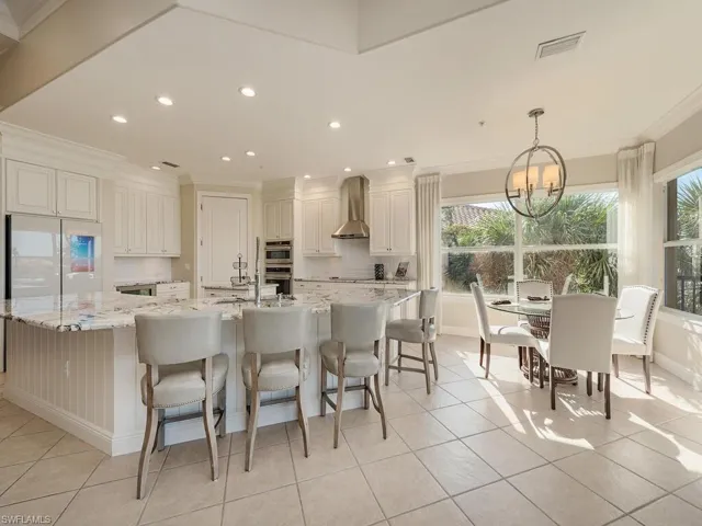 Bright and airy kitchen with lots of natural light, breakfast bar, breakfast nook and open to the lanai