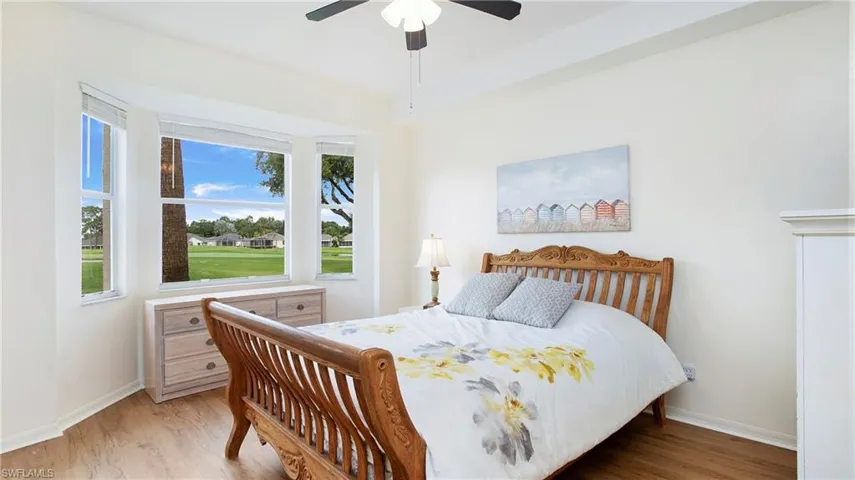Bedroom featuring ceiling fan and light hardwood / wood-style floors