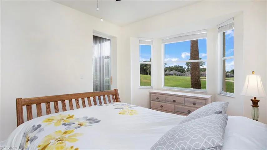 Bedroom featuring multiple windows