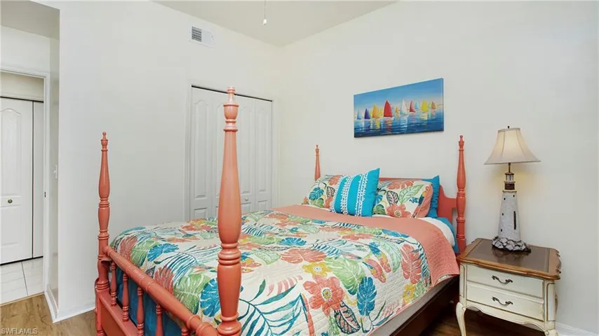 Bedroom featuring a closet and wood-type flooring