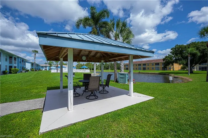 View of patio with a gazebo and a water view