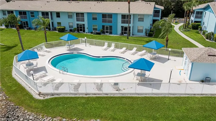 Community pool featuring a patio