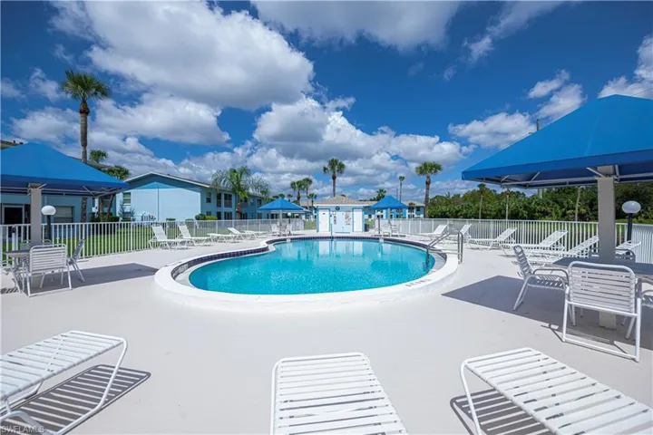 Community pool featuring a patio