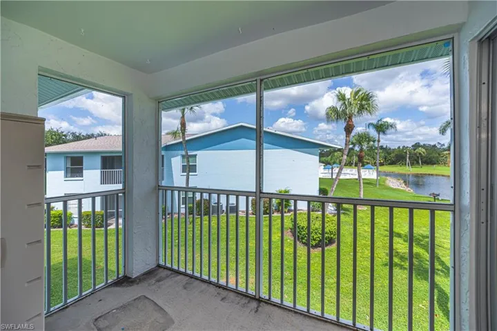 Unfurnished sunroom featuring a water view