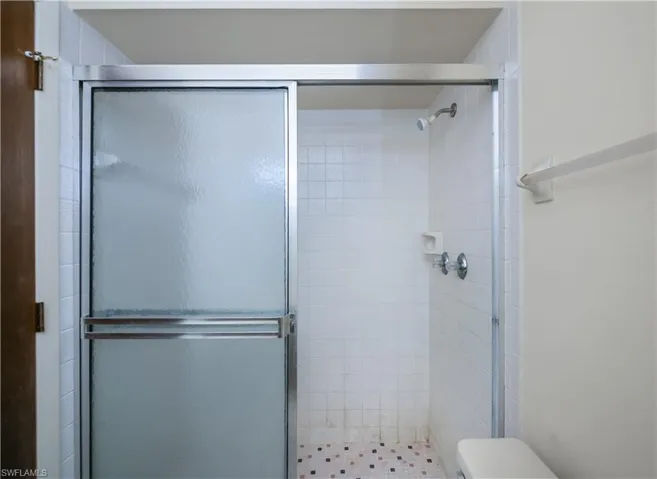 Full bath featuring a stall shower