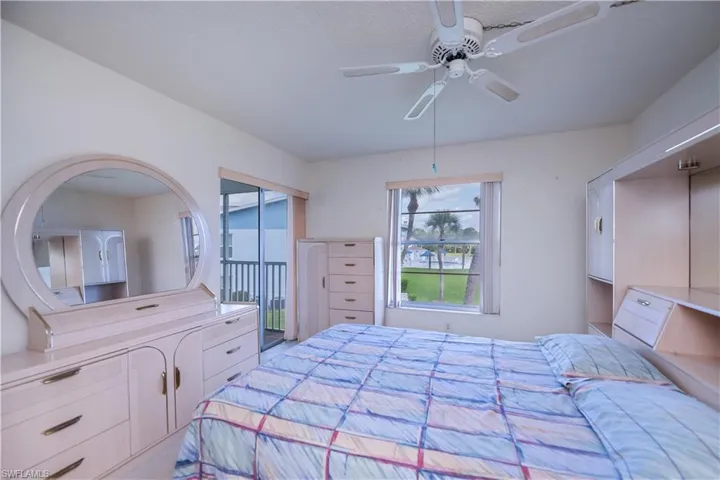 Bedroom featuring ceiling fan and access to exterior