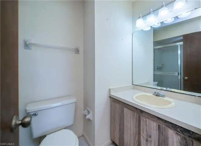 Bathroom with vanity and a shower stall