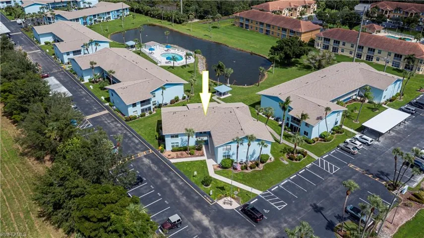 Aerial view of a nearby body of water and a pool area