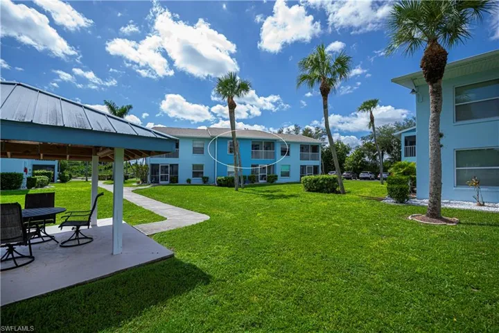 View of green lawn featuring a patio and a gazebo