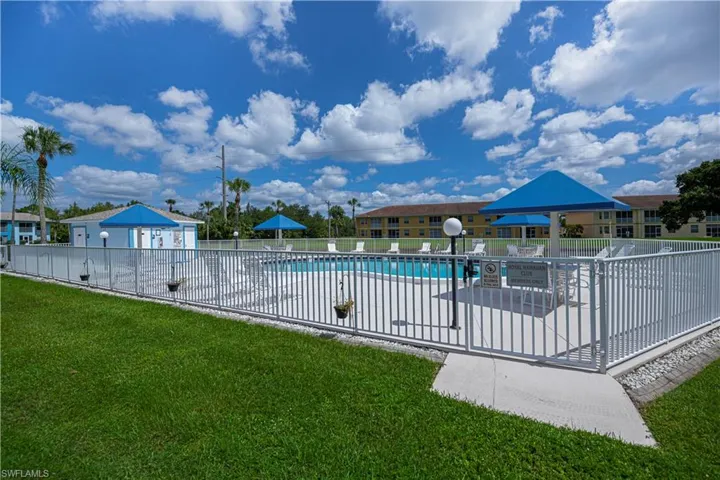 Community pool with a patio area