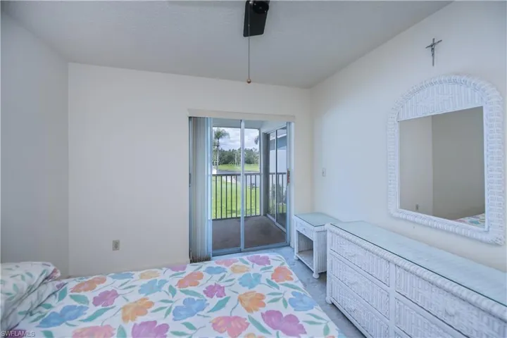 Bedroom featuring access to outside and ceiling fan