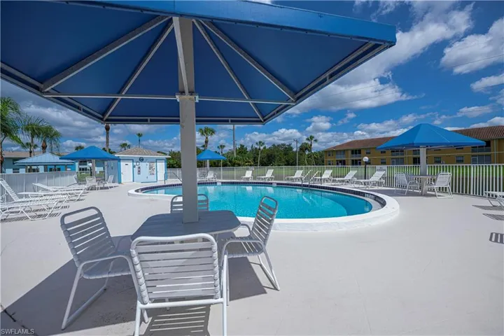 Community pool with a gazebo and a patio