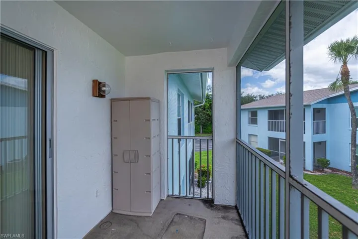 Balcony featuring a sunroom