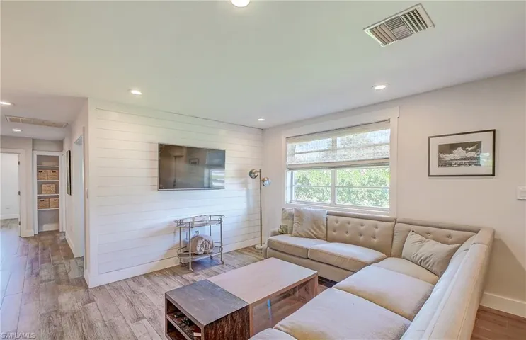 Living room with light wood-type flooring
