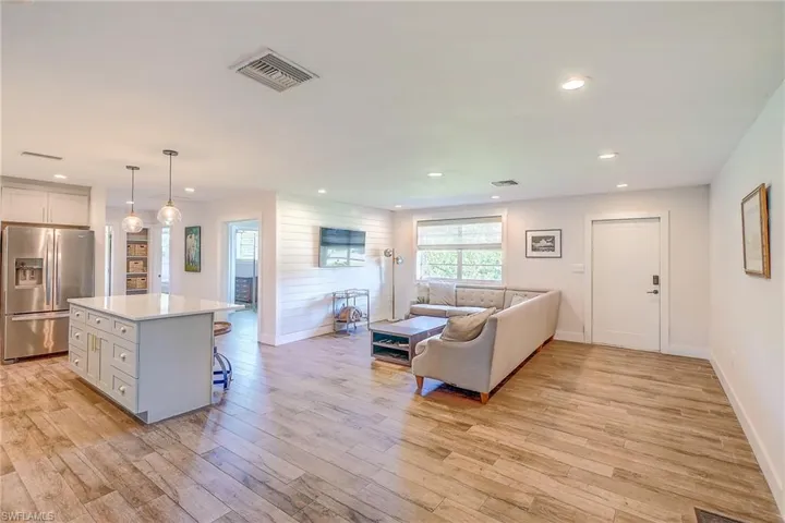 Living room with light hardwood / wood-style flooring