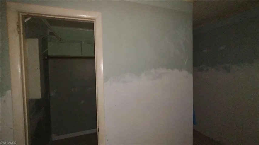 Primary Bedroom Closet area and bathroom entrance to the right