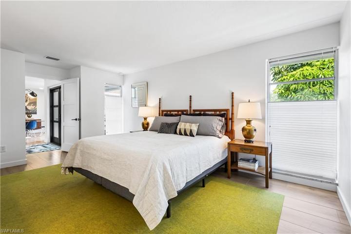 Oversized primary bedroom has lots of natural light.