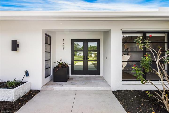 Lovely double door hurricane impact front entry.