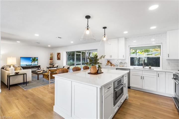 Oversized island, stainless steel appliances, 42" shaker style cabinets.