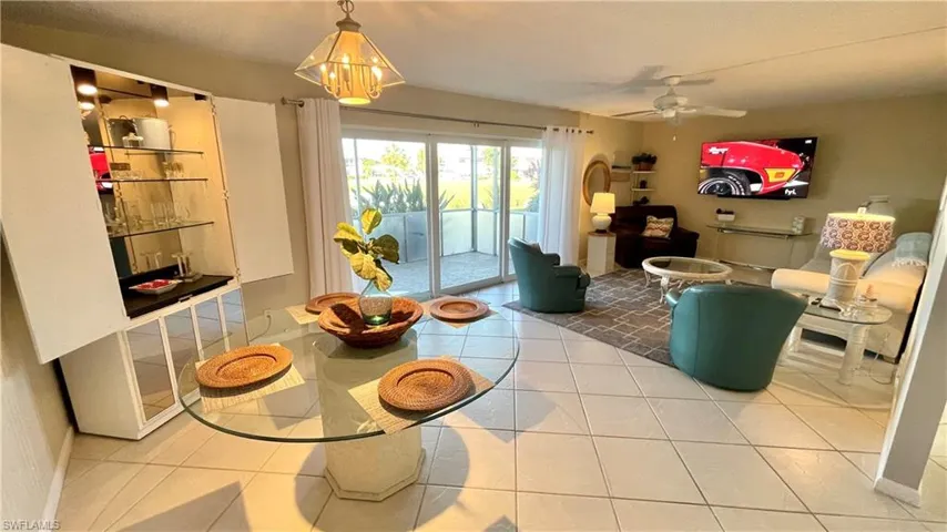 Living/ dining area featuring tile patterned floors