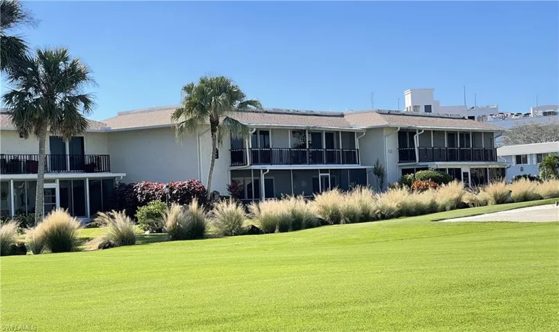 Rear view of condo from golf course.
