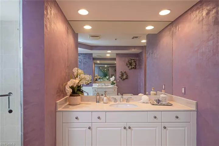 Full bathroom featuring recessed lighting, vanity, and a shower stall
