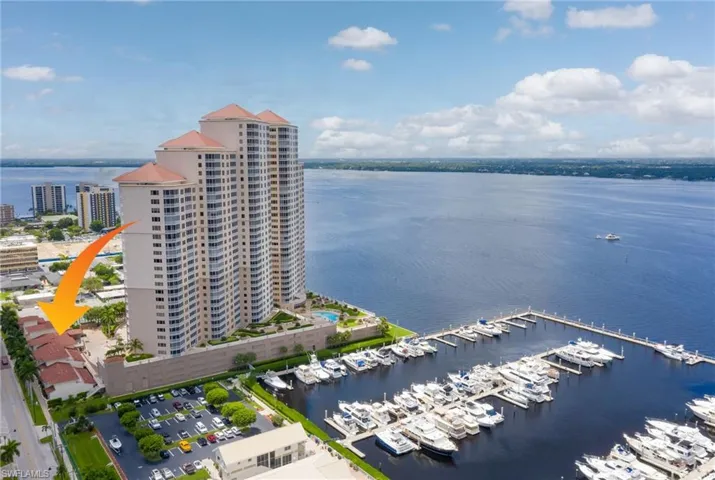 Aerial view of numerous boat docks and a nearby body of water