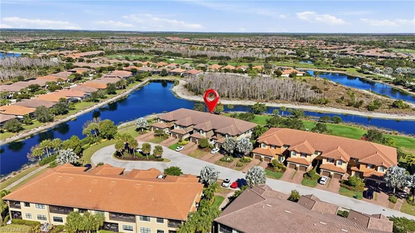 Aerial view of residential area with a large body of water
