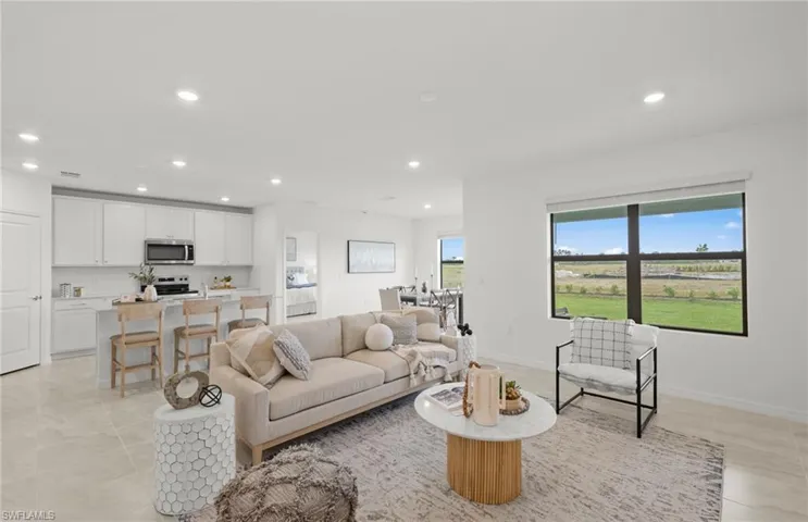 Photos of the actual home with some staged furnishings.
