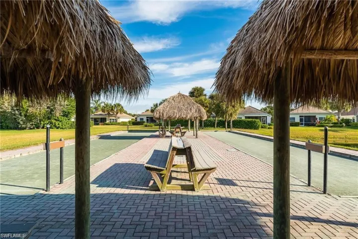 View of property's community featuring a gazebo, a bocce ball area, and a yard