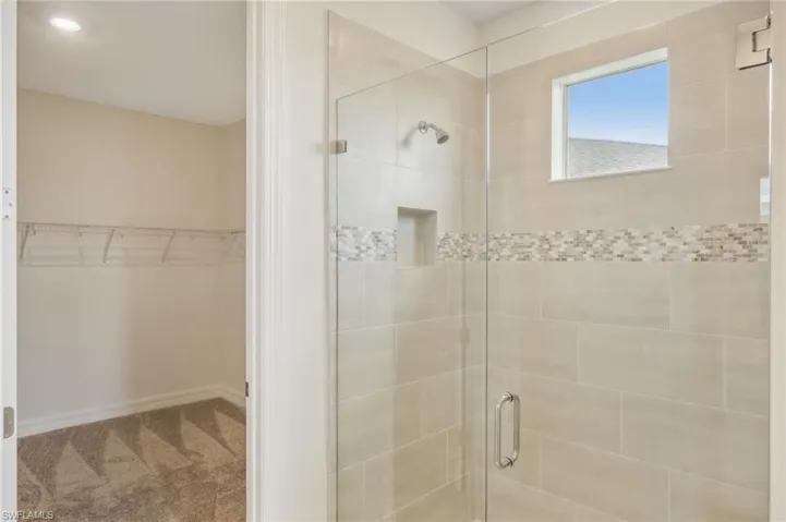 Bathroom featuring a shower with shower door
