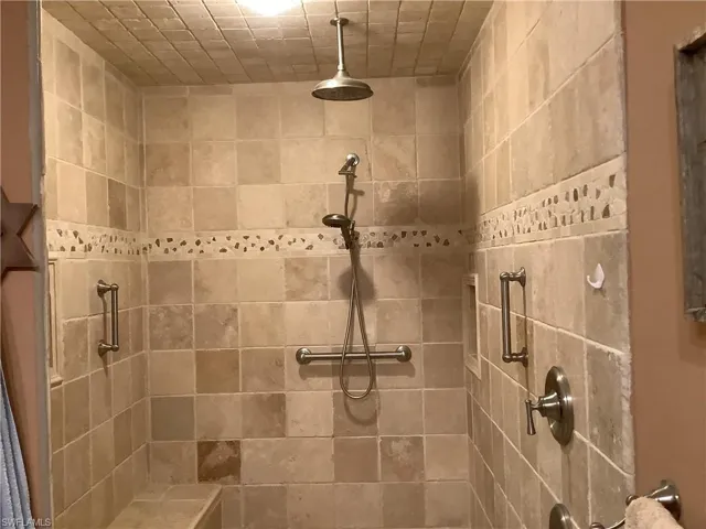 Large master walk in shower with seat