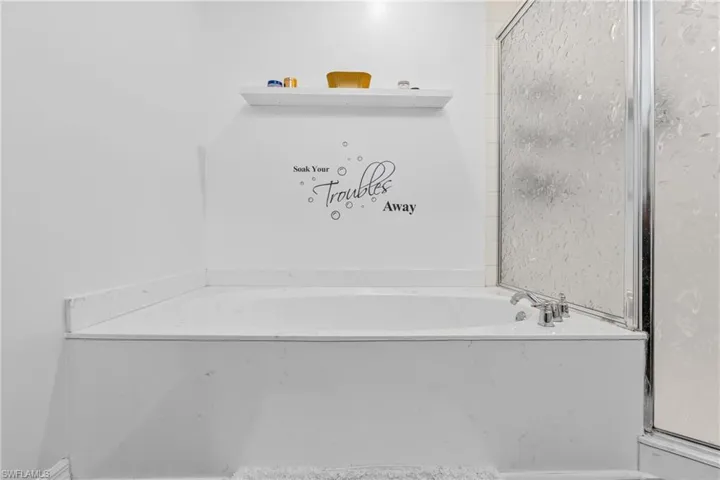 Bathroom featuring a tub to relax in