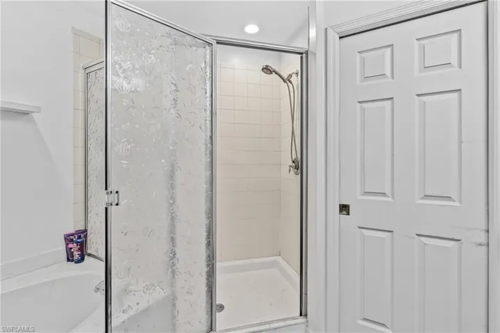 Bathroom featuring plus walk in shower