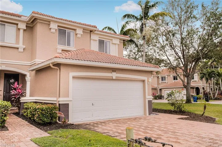 Mediterranean / spanish-style house with a garage