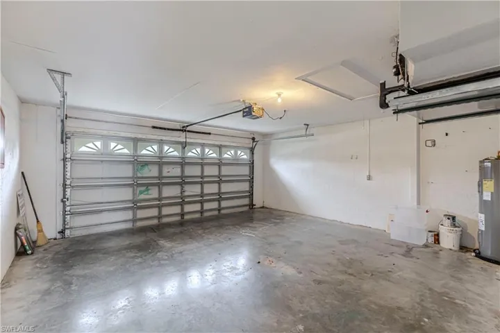 Garage with a garage door opener and water heater