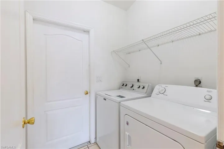 Laundry area featuring washer and clothes dryer